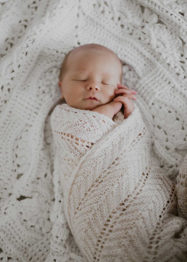 Newborn on bed